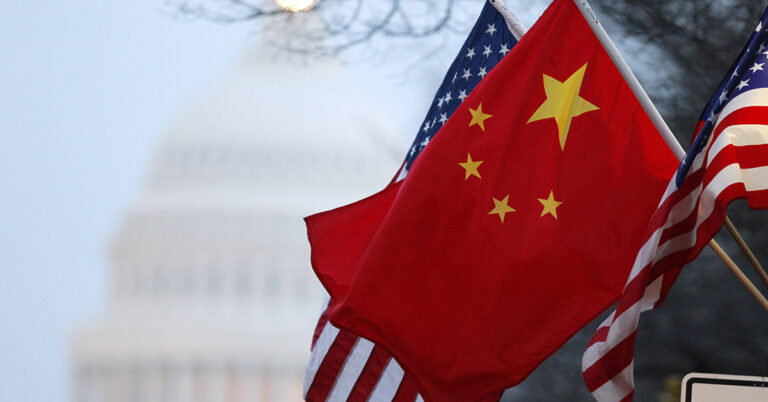 The People's Republic of China flag and the U.S. Stars and Stripes fly along Pennsylvania Avenue near the U.S. Capitol in Washington